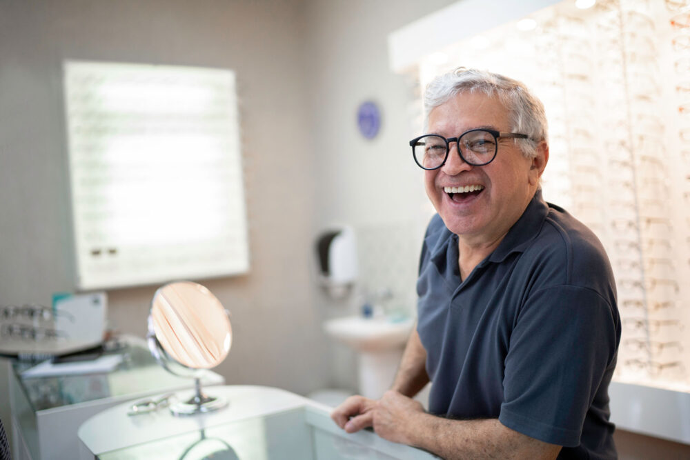 man in business casual shirt smiling